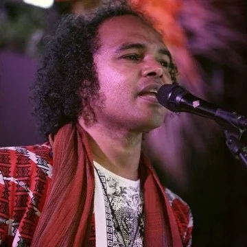 Close-up of Dino Miranda singing live